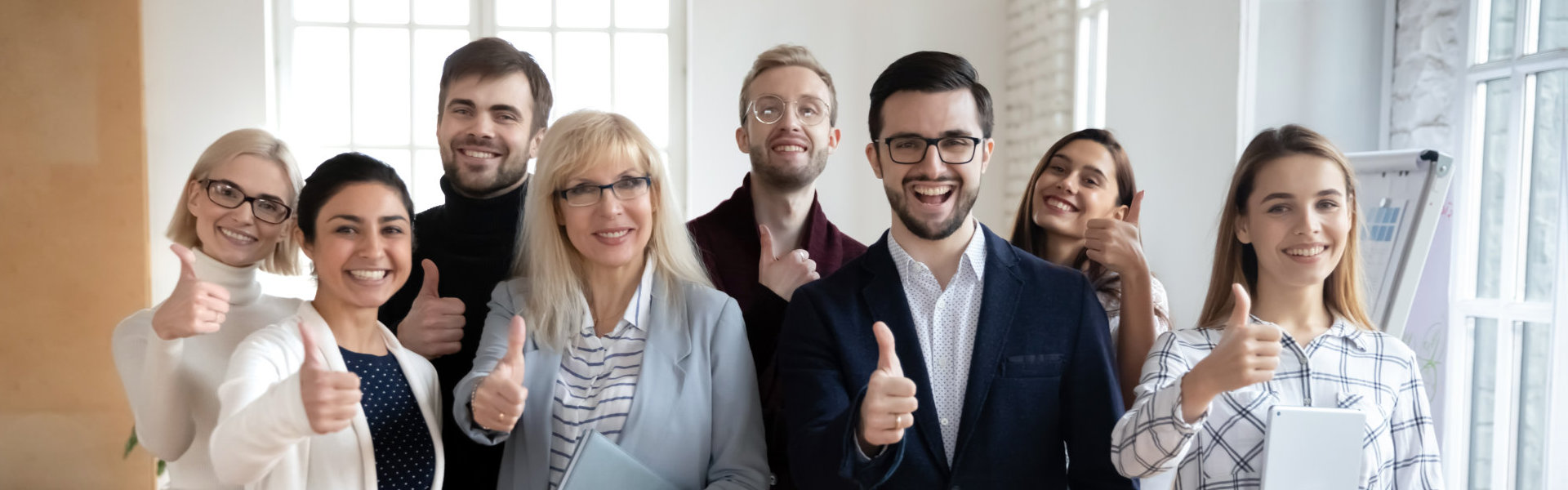 group of people showing thumbs up